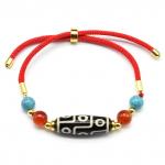 Браслет из агата Дзи Девять глаз бочонок 10*28мм цв.черный