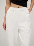 Белые зауженные брюки из хлопка